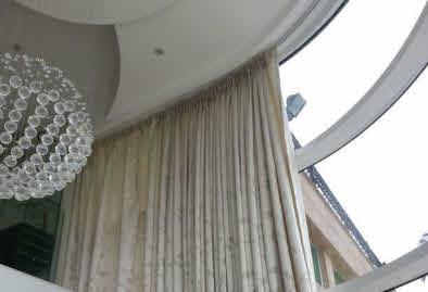 Curtain with curved track